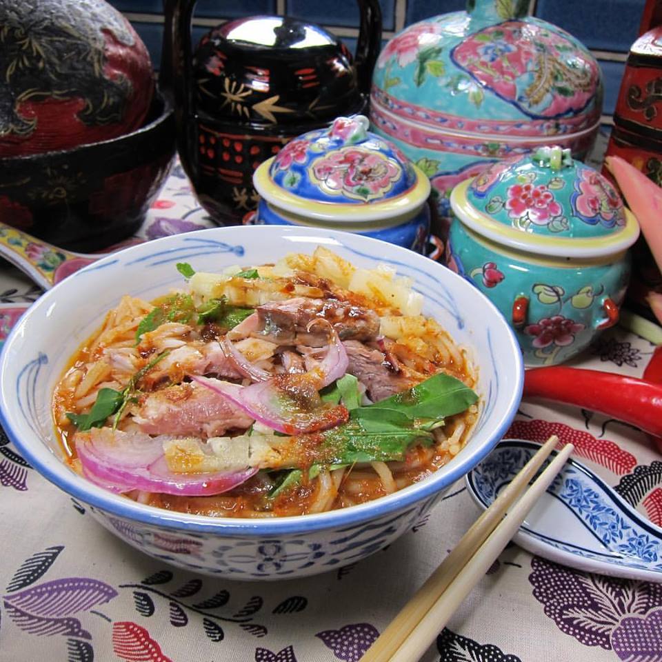 Assam Laksa is a bowl of noodles served in fish broth with tamarind and pineapple. The latter ingredients provide a sour note to the dish.